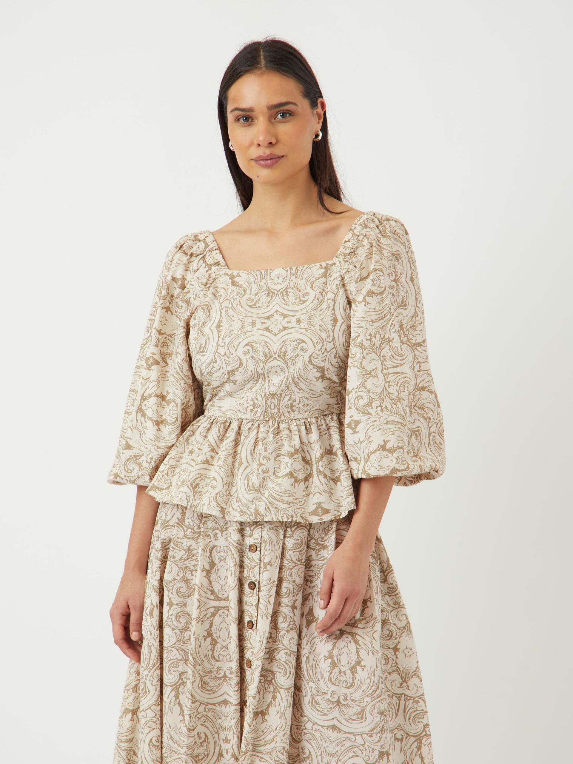 Sara Bow Back Peplum Top