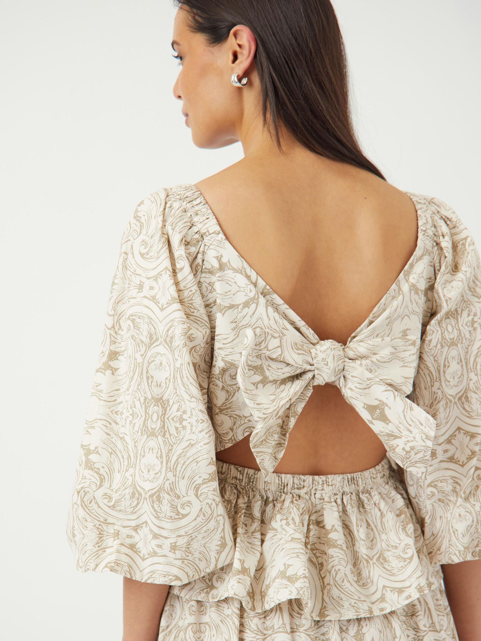 Sara Bow Back Peplum Top
